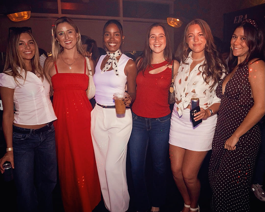 A group of friends together on the dance floor